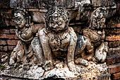 Thailand, Old Sukhothai - Wat Mahathat, stucco figures that decorate the base of the multi-layered chedi to the South of the complex.